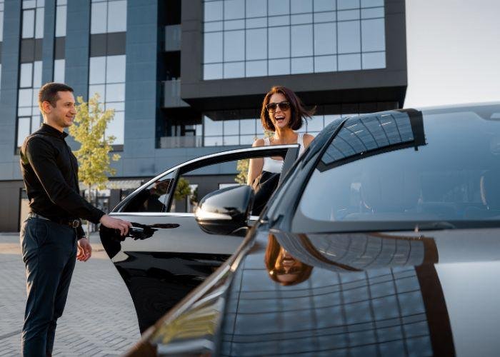 Corporate chauffeur hire Sydney - Chauffeured Solutions driver with his client